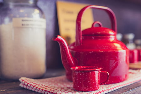 selective focus photography of red teapot and teacup thumbnail