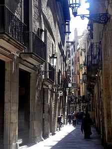 group of people near brown painted concrete buildings thumbnail