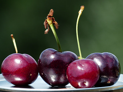 closeup photography of two cherry and two grapes on stainless steel tray thumbnail