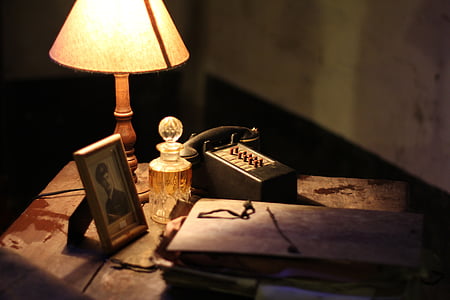 table lamp beside photo frame on table thumbnail