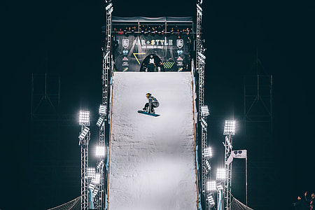 man riding on snowboard during daytime thumbnail
