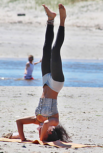 woman standing upside down on yoga mat thumbnail