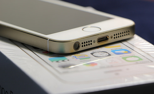gold iPhone 5s on top of box thumbnail