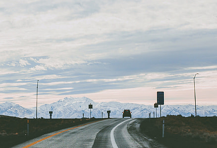 gray pave road during daytime thumbnail