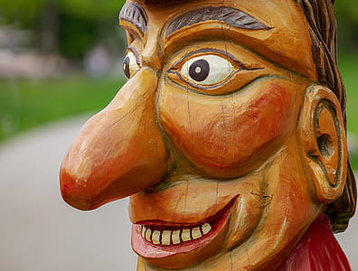 man's face wooden figurine thumbnail