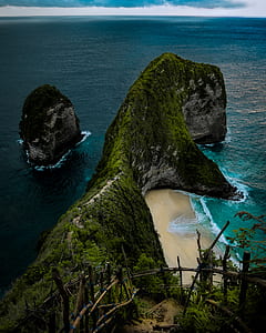 aerial photography of rock formation on seashore thumbnail