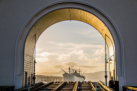 white ship near dock banks thumbnail