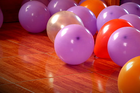 purple and orange balloons on brown surface thumbnail