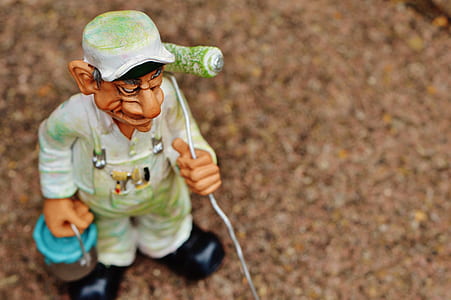 shallow focus photo of painter figurine thumbnail