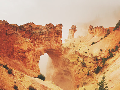 gray cliff during foggy day thumbnail