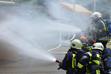 firemen spraying with water hose thumbnail
