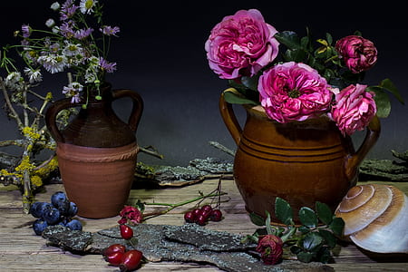 assorted-color petaled flowers in vases thumbnail