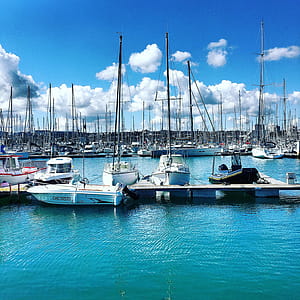 Three White Motorboat on Body of Water thumbnail