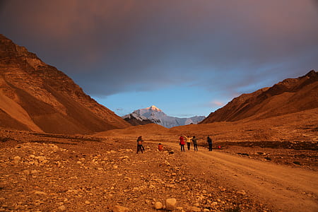 people on valley under thick clouds at daytime thumbnail