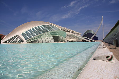 gray concrete structure beside body of water thumbnail