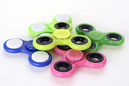 stacked assorted-color fidget hand spinners thumbnail