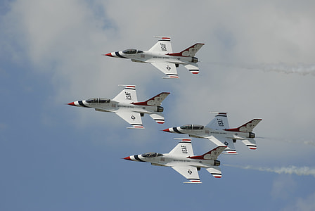 four white-and-red planes flying in formation thumbnail