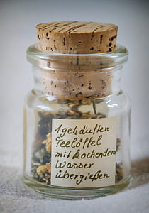 Paper Inside Clear Glass Jar With Brown Cork thumbnail