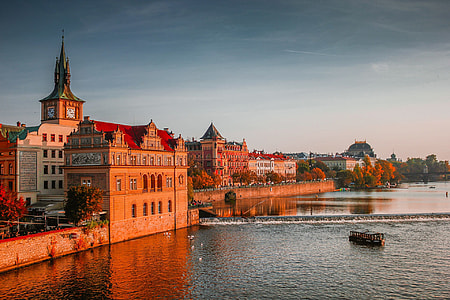 Sunset view of the river and shoreline buildings in Prague, Czech Republic thumbnail