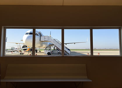 white airplane on gray surface thumbnail