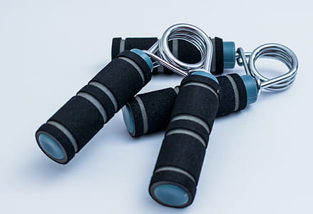 pair of hand grips on white surface thumbnail