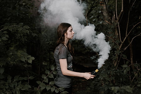 woman holding smoke bomb thumbnail