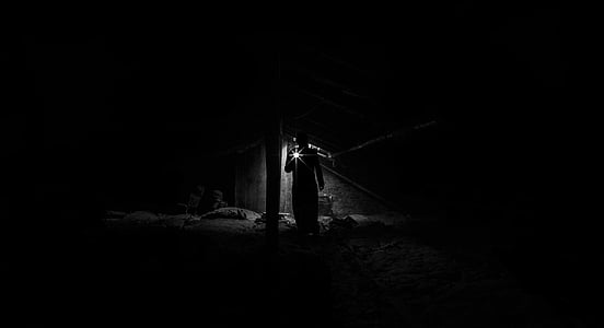 silhouette of man holding light thumbnail