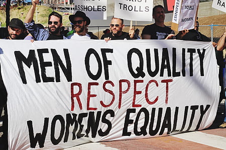 group of men holding signage of men of quality respect womens equality thumbnail