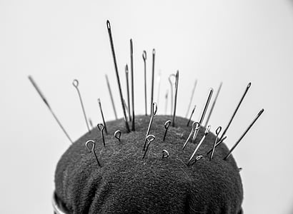 selective focus photography of pins in pin cushion thumbnail