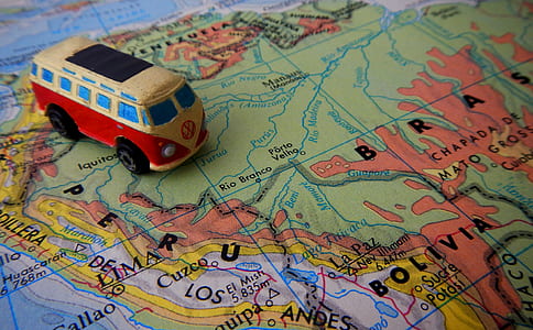 red and yellow Volkswagen Transporter 2 scale model toy on map thumbnail