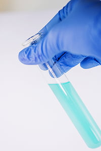 shallow focus photography of cyan liquid filled test tube thumbnail