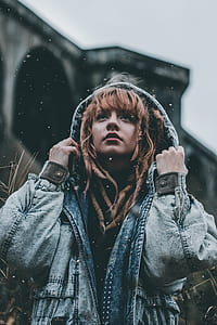woman in blue denim hoodie looking up thumbnail