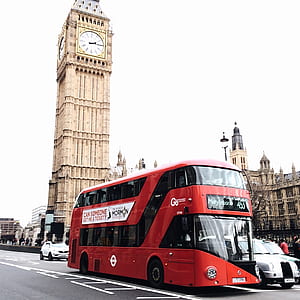 Red Bus on Road Near Big Ben in London thumbnail