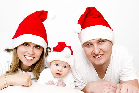 man, woman, and baby posing for photo thumbnail