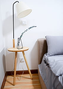 White Shade Table Lamp Near Bed thumbnail