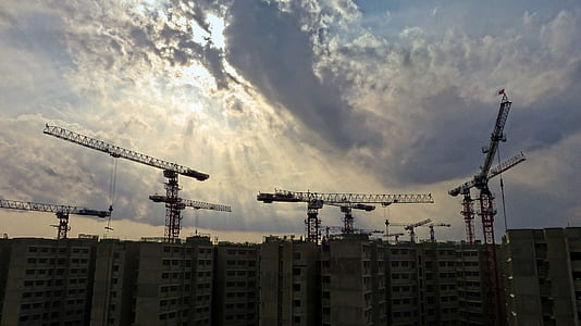 sunlight through clouds over city thumbnail