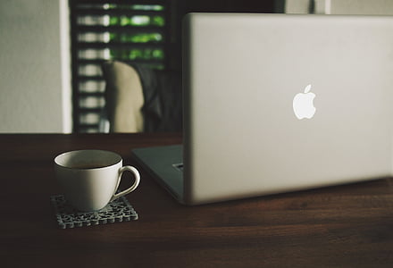 silver MacBook beside mug thumbnail