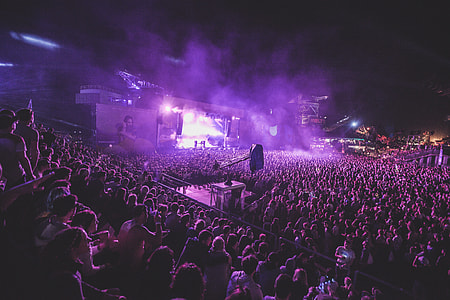 people gathering on stage during nighttime thumbnail