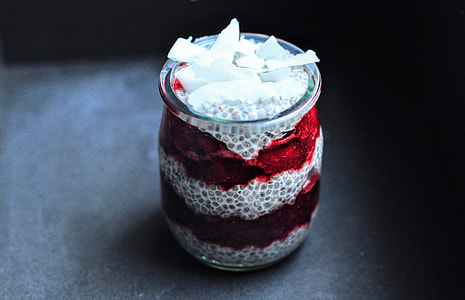 white and red votive candle in close-up photography thumbnail