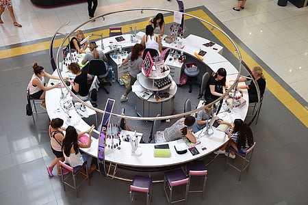 high angle photo of people sitting around conference table thumbnail