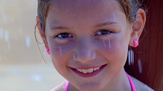 close-up photography of smiling girl wearing pink halter-strap top thumbnail