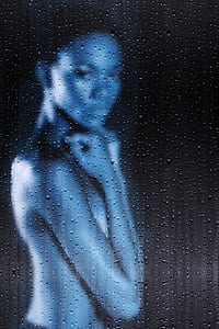 topless woman behind frosted glass with raindrops thumbnail