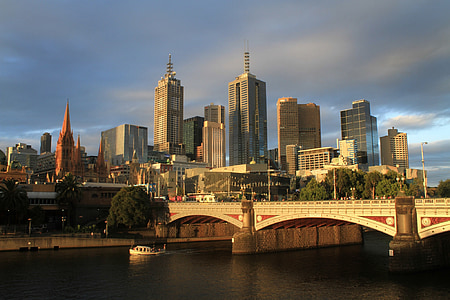 city building near bridge during daytime thumbnail