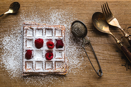 Breakfast waffles with fresh raspberries and powdered sugar thumbnail