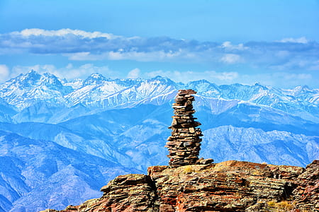 pile of brown stones in front of mountain thumbnail