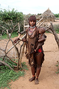 woman carrying child thumbnail