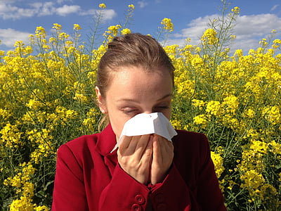 woman wearing red top sneezing thumbnail