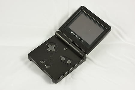 black Nintendo Gameboy Advance on white textile thumbnail