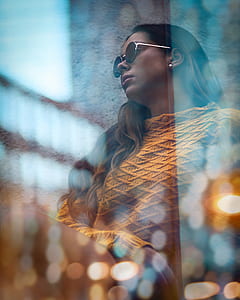 bokeh lights photography of woman wearing brown sweater thumbnail