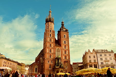 people near brown cathedral during daytime thumbnail